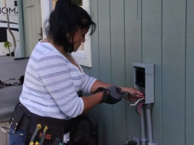 Licensed electrician wiring an exterior subpanel in Jamul